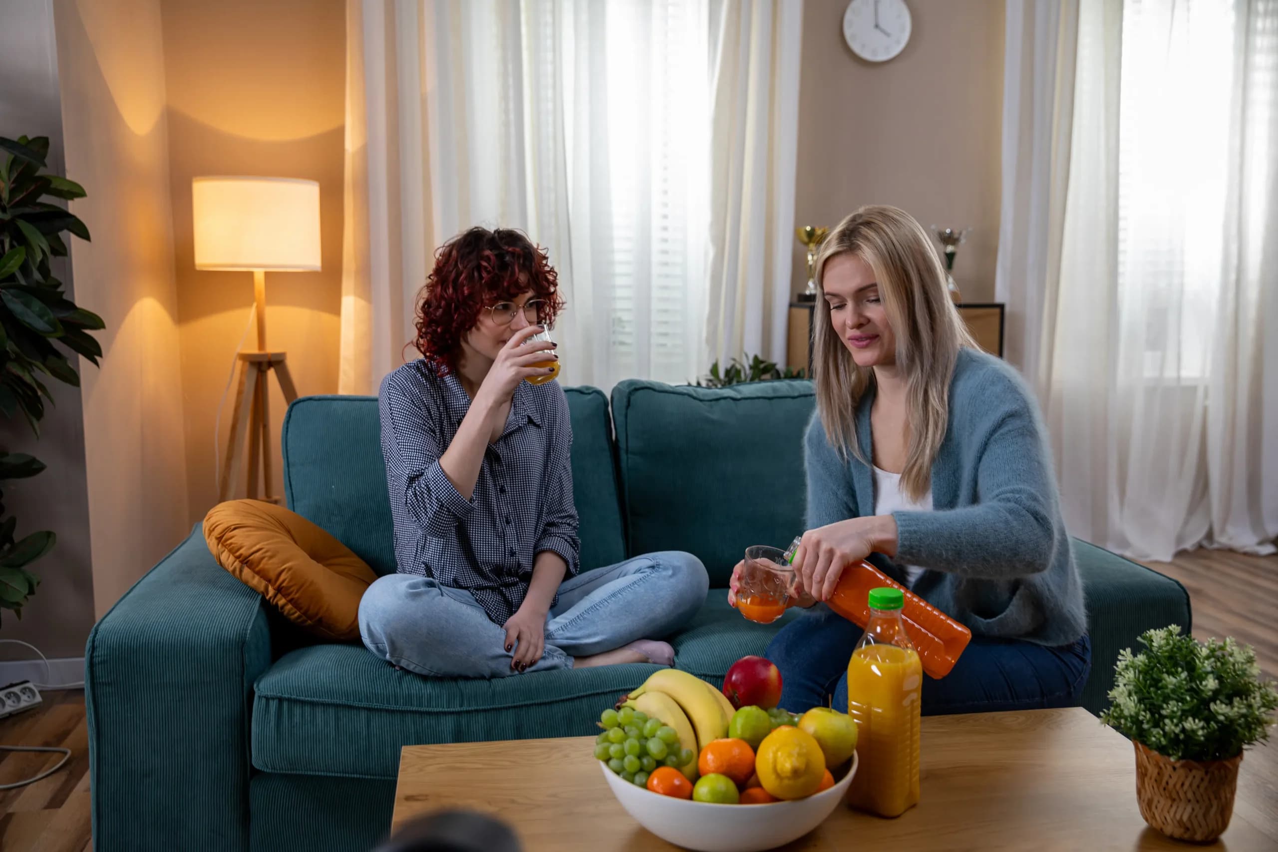 Two women sharing a conversation at home
